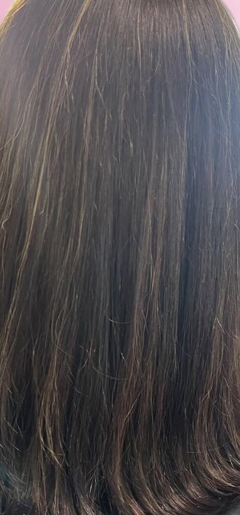 Grown-out brunette balayage with soft dimension